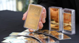 Đồng USD mạnh lên đẩy giá vàng thế giới đi xuống