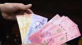 Syria bắt đầu đổi tiền sau khủng hoảng do xung đột kéo dài