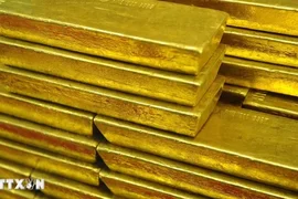 Giá vàng giảm trước sức ép từ USD và trái phiếu