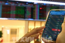 Phần lớn thị trường chứng khoán châu Á giảm điểm trước áp lực kép