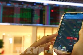 Phần lớn thị trường chứng khoán châu Á giảm điểm trước áp lực kép