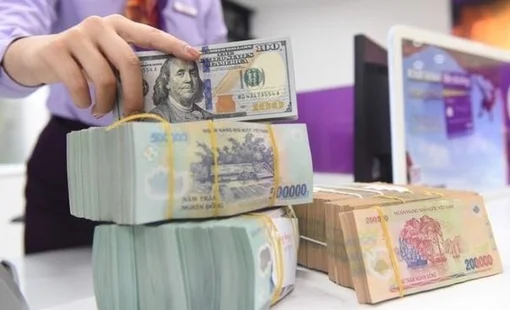 Standard Chartered: Tốc độ giảm giá của tiền đồng Việt Nam sẽ chậm lại