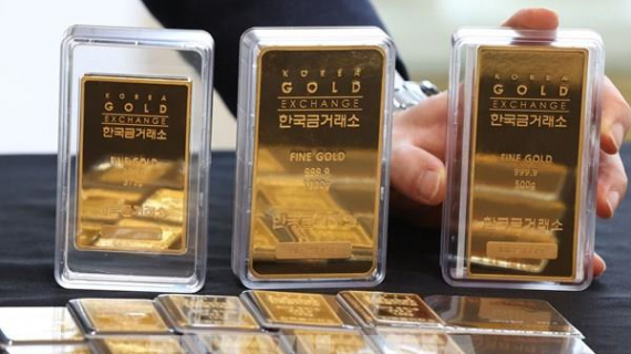 Giá vàng châu Á rời khỏi mức cao kỷ lục sau tín hiệu từ Fed